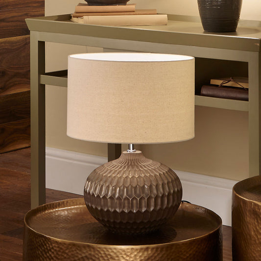Shop the Cassius Bronze Table Lamp with a layered bronze ceramic base and hand-applied metallic finish. FREE UK MAINLAND DELIVERY. Shop online now at www.nobleandnook.co.uk