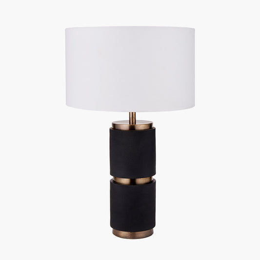 The Alnico Table Lamp is designed to bring dramatic elegance to your space. Featuring a textured black and brass base, this lamp captures the eye and adds depth to your decor. Available at www.nobleandnook.co.uk