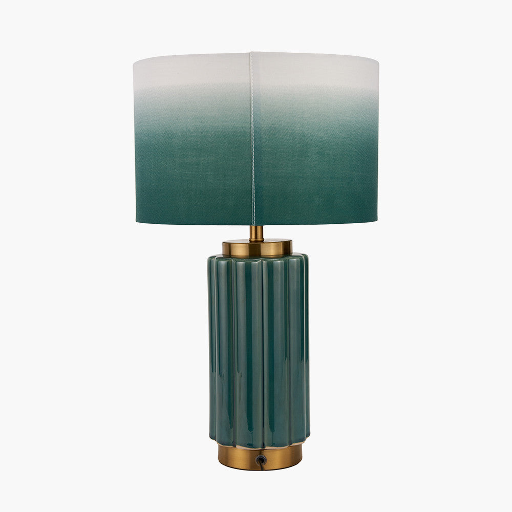 Green table lamp with a gradient shade on a white background