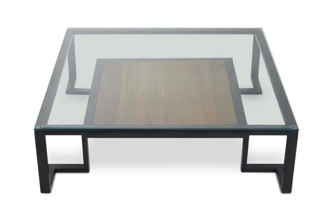 Featuring a refined balance of materials, its clear glass top is perfectly framed by a black metal structure, complemented by a warm teak wood shelf below. Shop online today at www.nobleandnook.co.uk