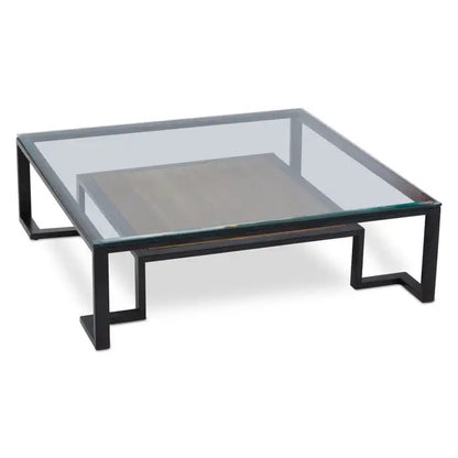 Featuring a refined balance of materials, its clear glass top is perfectly framed by a black metal structure, complemented by a warm teak wood shelf below. Shop online today at www.nobleandnook.co.uk