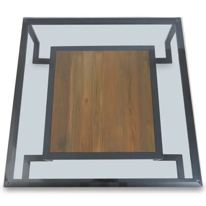 Featuring a refined balance of materials, its clear glass top is perfectly framed by a black metal structure, complemented by a warm teak wood shelf below. Shop online today at www.nobleandnook.co.uk
