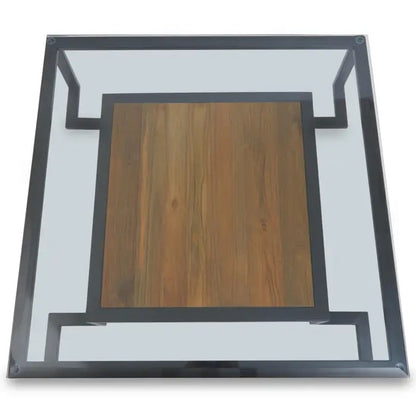 Featuring a refined balance of materials, its clear glass top is perfectly framed by a black metal structure, complemented by a warm teak wood shelf below. Shop online today at www.nobleandnook.co.uk