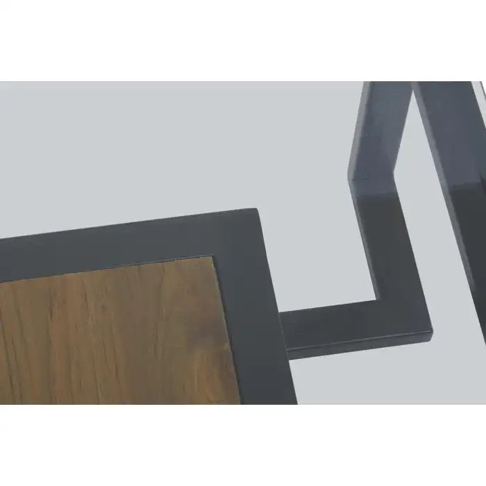 Featuring a refined balance of materials, its clear glass top is perfectly framed by a black metal structure, complemented by a warm teak wood shelf below. Shop online today at www.nobleandnook.co.uk