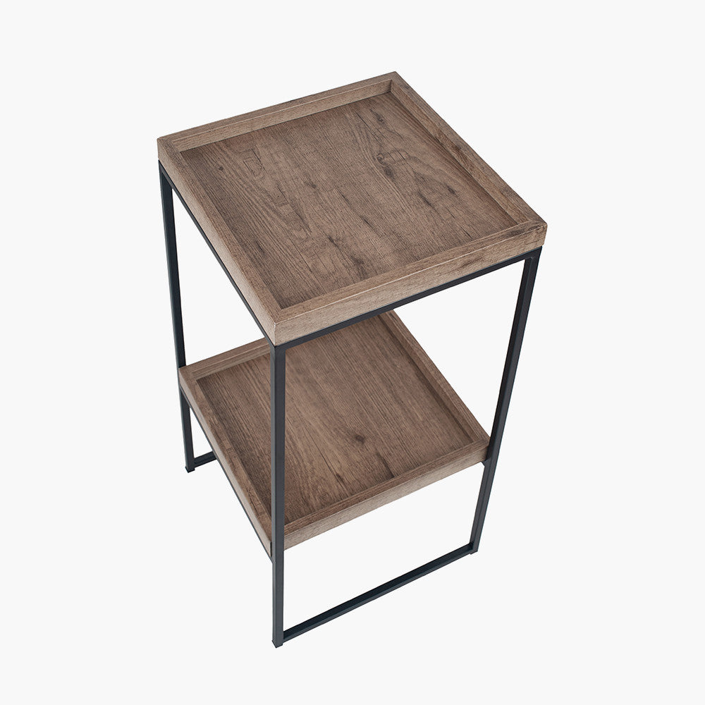 The Gallery Natural Wood Veneer and Black Metal Side Table adds a modern charm and functionality to your living space. W35xD35xH70cm. Available at www.nobleandnook.co.uk