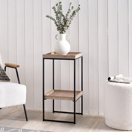 The Gallery Natural Wood Veneer and Black Metal Side Table adds a modern charm and functionality to your living space. W35xD35xH70cm. Available at www.nobleandnook.co.uk