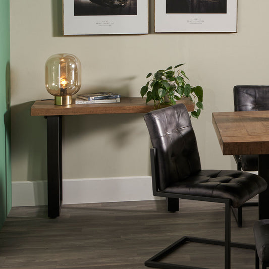 The Pahoja Console Table with an intricate inlaid mango wood top and black black iron legs offering a modern edge, perfect functional accent in any space. Available now at www.nobleandnook.co.uk