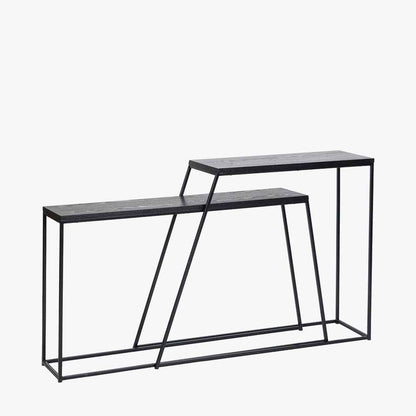 Add bold style and adaptability to your home with the Mashiko Black Ash Veneer and Black Metal Console Tables. Set of two versatile tables with sleek black ash veneer tops. Shop online today at www.nobleandnook.co.uk