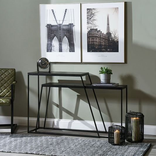 Add bold style and adaptability to your home with the Mashiko Black Ash Veneer and Black Metal Console Tables. Set of two versatile tables with sleek black ash veneer tops. Shop online today at www.nobleandnook.co.uk