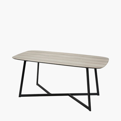 Ukiah Grey Oak Veneer and Black Metal Dining Table, featuring a grey oak veneer top with soft, rounded edges, paired with sturdy black metal legs. W180xD91xH76cm. Available at www.nobelandnook.co.uk