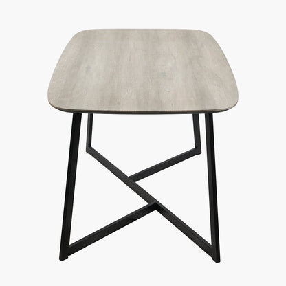 Ukiah Grey Oak Veneer and Black Metal Dining Table, featuring a grey oak veneer top with soft, rounded edges, paired with sturdy black metal legs. W180xD91xH76cm. Available at www.nobelandnook.co.uk