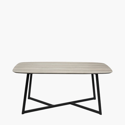 Ukiah Grey Oak Veneer and Black Metal Dining Table, featuring a grey oak veneer top with soft, rounded edges, paired with sturdy black metal legs. W180xD91xH76cm. Available at www.nobelandnook.co.uk