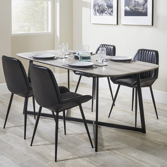 Ukiah Grey Oak Veneer and Black Metal Dining Table, featuring a grey oak veneer top with soft, rounded edges, paired with sturdy black metal legs. W180xD91xH76cm. Available at www.nobelandnook.co.uk