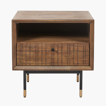 Shop the Arte Bedside Unit in dark brown acacia wood with etched detailing and sleek black metal legs, one drawer and open niche offer ample storage for essentials. Shop online today at www.nobleandnook.co.uk