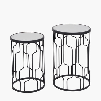 Set of Two Elegant Art Deco Design Side Tables – Includes one large and one small table for versatile styling. Black metal frames with circular silhouettes and mirrored glass tops. Available at www.nobleandnook.co.uk