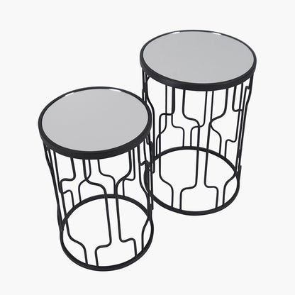 Set of Two Elegant Art Deco Design Side Tables – Includes one large and one small table for versatile styling. Black metal frames with circular silhouettes and mirrored glass tops. Available at www.nobleandnook.co.uk