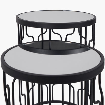 Set of Two Elegant Art Deco Design Side Tables – Includes one large and one small table for versatile styling. Black metal frames with circular silhouettes and mirrored glass tops. Available at www.nobleandnook.co.uk
