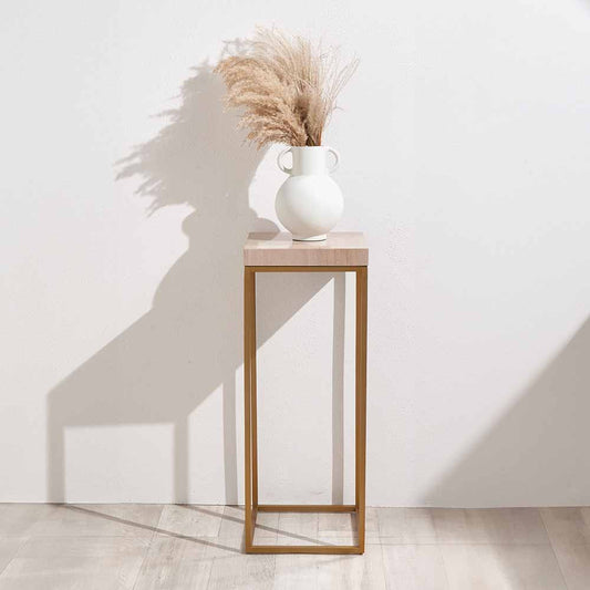 Shop the Madison tall side table, boasting warm burnished gold metal legs and a sophisticated beige granite top, this contemporary piece adds a touch of luxury to any room. Shop online now at www.nobleandnook.co.uk