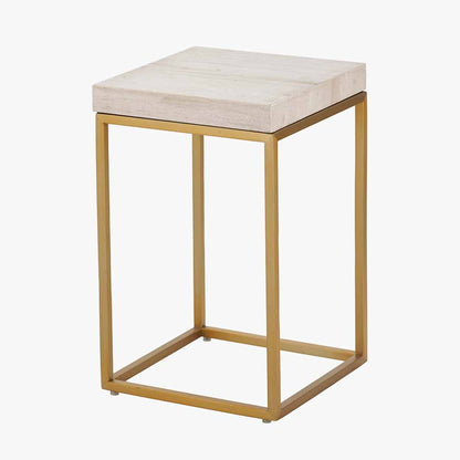 Shop the Madison side table, a contemporary design with warm burnished gold legs and a beige granite top. A luxurious addition to your home decor. Shop online today at www.nobleandnook.co.uk