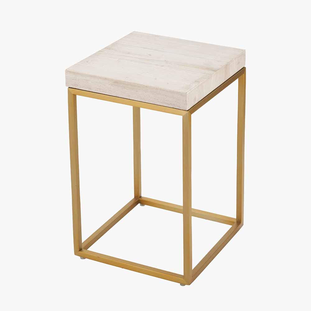 Shop the Madison side table, a contemporary design with warm burnished gold legs and a beige granite top. A luxurious addition to your home decor. Shop online today at www.nobleandnook.co.uk