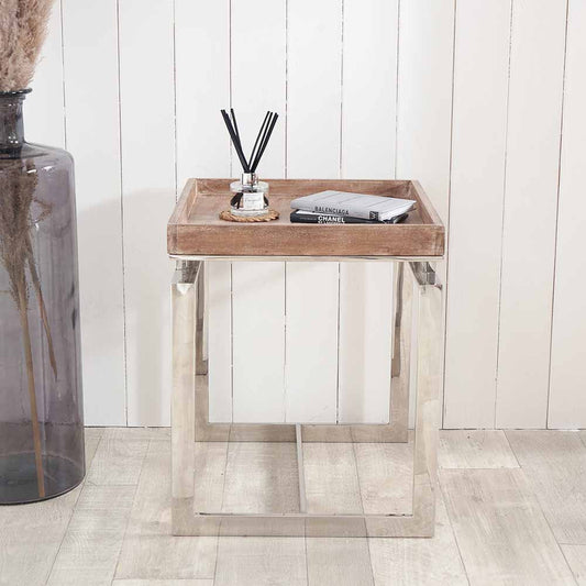Shop the Evelyn Side Table, featuring a hand-finished antique mango wood top and a polished stainless steel frame. Dimensions W46xD46xH55cm. Shop online today at www.nobleandnook.co.uk