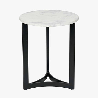 This striking Side Table pairs a luxurious marble top with gracefully curved black metal legs, creating a sophisticated contrast of texture and form. Dimensions W46xD46xH56cm. Shop online today at www.nobleandnook.co.uk