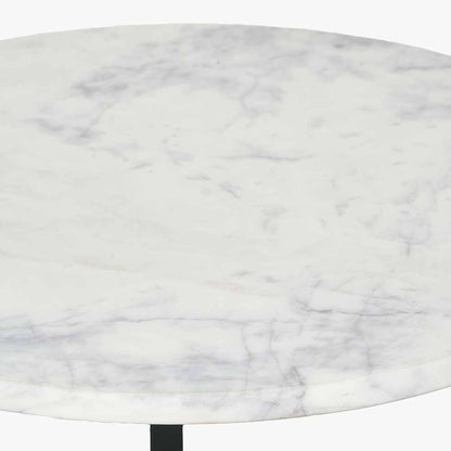 This striking Side Table pairs a luxurious marble top with gracefully curved black metal legs, creating a sophisticated contrast of texture and form. Dimensions W46xD46xH56cm. Shop online today at www.nobleandnook.co.uk