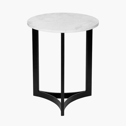 This striking Side Table pairs a luxurious marble top with gracefully curved black metal legs, creating a sophisticated contrast of texture and form. Dimensions W46xD46xH56cm. Shop online today at www.nobleandnook.co.uk