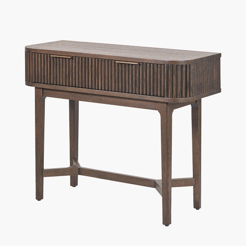 Shop the Raie Console Table with Ribbed Wood Detailing with two spacious drawers. High-quality construction. Dimensions W100xD38xH80cm. Shop online to day at www.nobleandnook.co.uk