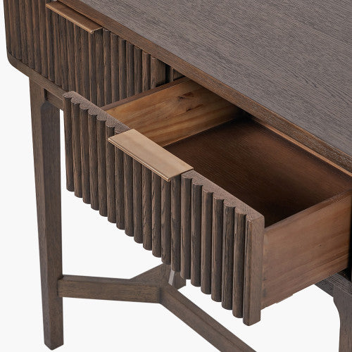 Shop the Raie Console Table with Ribbed Wood Detailing with two spacious drawers. High-quality construction. Dimensions W100xD38xH80cm. Shop online to day at www.nobleandnook.co.uk
