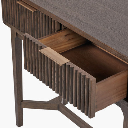 Shop the Raie Console Table with Ribbed Wood Detailing with two spacious drawers. High-quality construction. Dimensions W100xD38xH80cm. Shop online to day at www.nobleandnook.co.uk