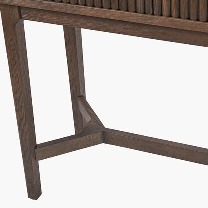 Shop the Raie Console Table with Ribbed Wood Detailing with two spacious drawers. High-quality construction. Dimensions W100xD38xH80cm. Shop online to day at www.nobleandnook.co.uk