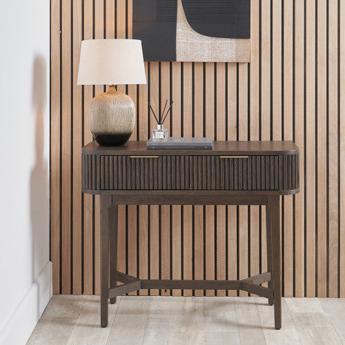 Shop the Raie Console Table with Ribbed Wood Detailing with two spacious drawers. High-quality construction. Dimensions W100xD38xH80cm. Shop online to day at www.nobleandnook.co.uk