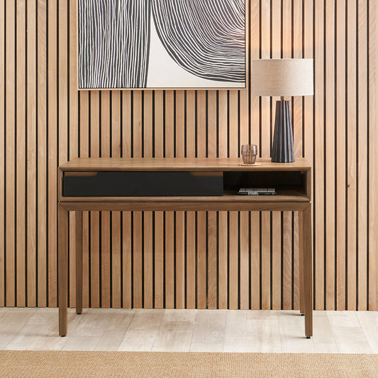 Crafted from solid acacia wood with a striking natural top and black frame, offering a bold, contemporary contrast. Scandinavian-Inspired Design. W120xD40xH80cm. www.nobleandnook.co.uk 