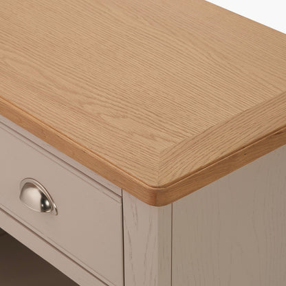 Add timeless country cottage charm to your home with the Fairford 2-Drawer Console Table. Crafted from pine wood with a parchment-white finish and oak-effect top, this elegant table offers practical storage and arrives fully assembled.