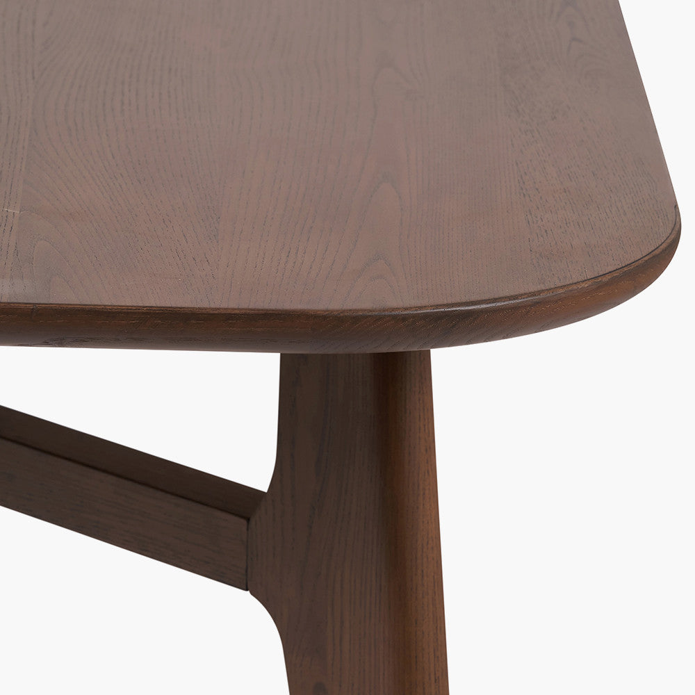 Shop the Elias Dining Table, blending minimalist elegance with Scandinavian-inspired design. Expertly crafted from solid ash wood with a stylish on-trend dark finish. Shop online today at www.nobleandnook.co.uk