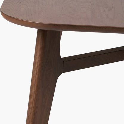 Shop the Elias Dining Table, blending minimalist elegance with Scandinavian-inspired design. Expertly crafted from solid ash wood with a stylish on-trend dark finish. Shop online today at www.nobleandnook.co.uk