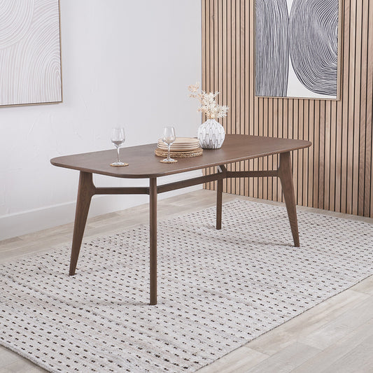 Shop the Elias Dining Table, blending minimalist elegance with Scandinavian-inspired design. Expertly crafted from solid ash wood with a stylish on-trend dark finish. Shop online today at www.nobleandnook.co.uk