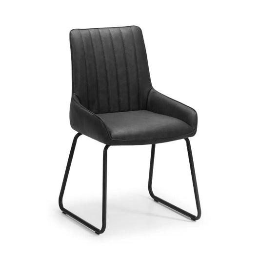Shop these antique black faux leather dining chairs with sleek black metal frame for industrial edge. Retro styling with a modern twist – ideal for urban interiors. Shop online today at www.nobleandnook.co.uk