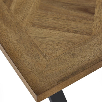 Shop the Aron Dining Table with eye-catching herringbone wood top with striking black metal base ensures lasting stability. Perfect for hosting dinners or enjoying everyday meals in style. Shop online at www.nobleandnook.co.uk