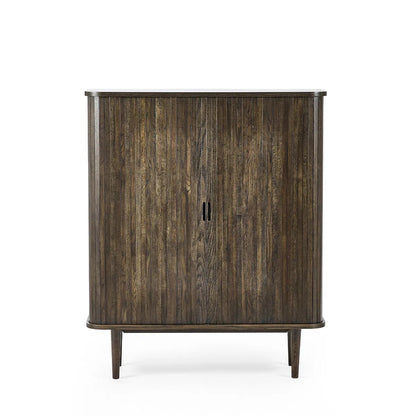 Add a touch of elegance and functionality to your entertaining space with the Arya Drinks Cabinet with sliding tambour doors reveal a well-designed interior. Available today at www.nobleandnook.co.uk