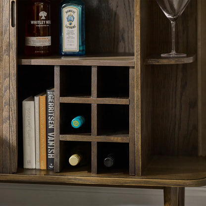Add a touch of elegance and functionality to your entertaining space with the Arya Drinks Cabinet with sliding tambour doors reveal a well-designed interior. Available today at www.nobleandnook.co.uk