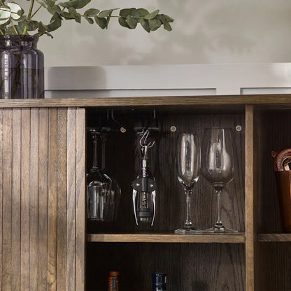 Add a touch of elegance and functionality to your entertaining space with the Arya Drinks Cabinet with sliding tambour doors reveal a well-designed interior. Available today at www.nobleandnook.co.uk
