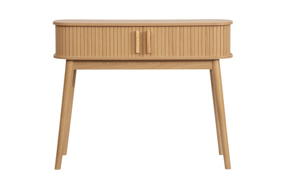 Elevate your interior with the Axel Console Table in an Oak Finish. This stylish table features exquisite fluted detailing, adds depth and sophistication to any living space. Shop online today at www.nobleandnook.co.uk