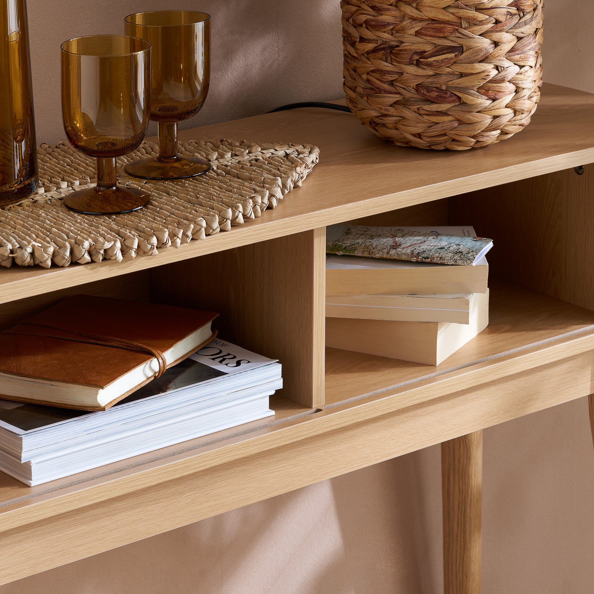 Elevate your interior with the Axel Console Table in an Oak Finish. This stylish table features exquisite fluted detailing, adds depth and sophistication to any living space. Shop online today at www.nobleandnook.co.uk