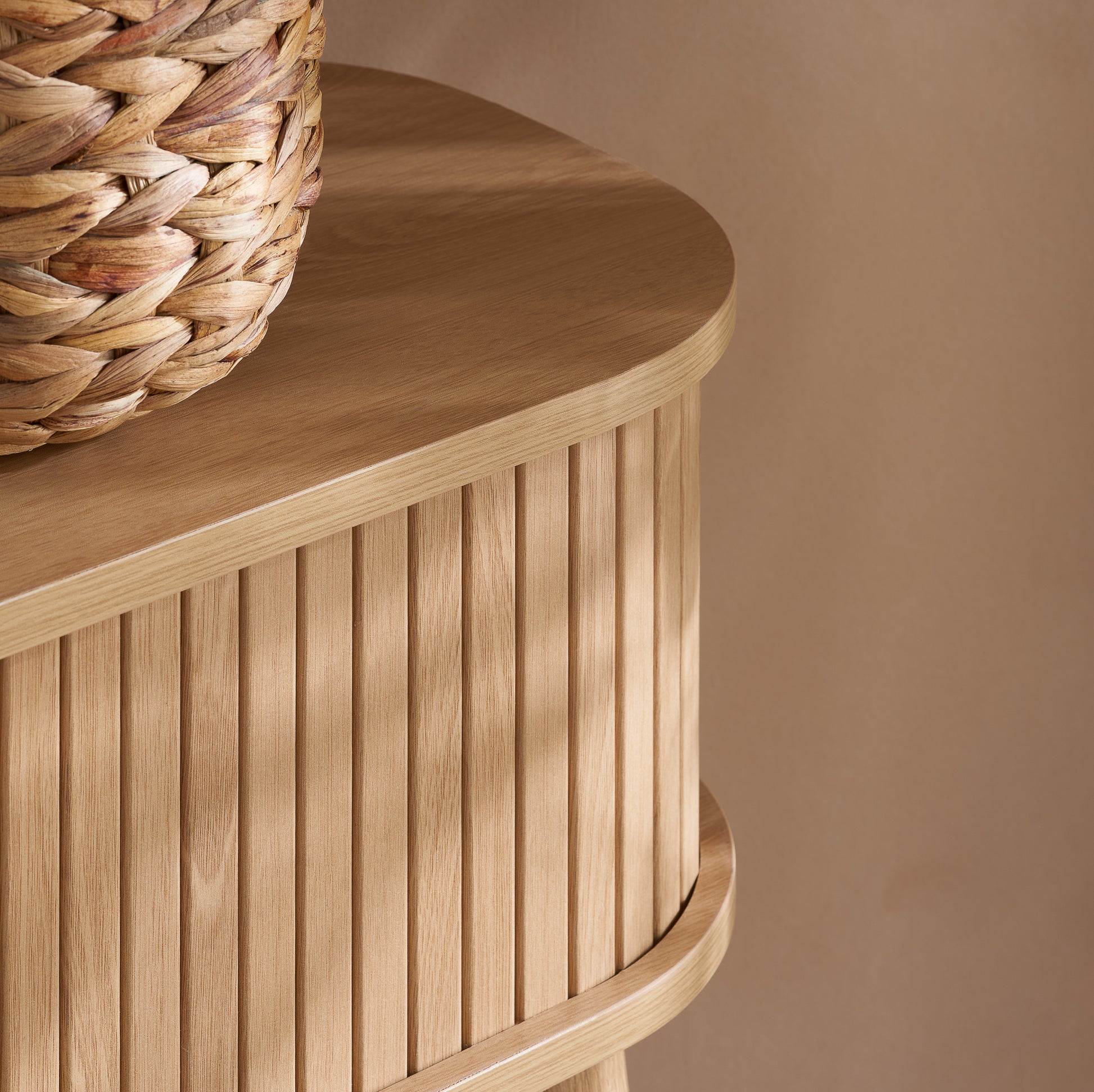 Elevate your interior with the Axel Console Table in an Oak Finish. This stylish table features exquisite fluted detailing, adds depth and sophistication to any living space. Shop online today at www.nobleandnook.co.uk