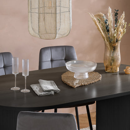 Crafted from premium MDF and available in two stylish finishes, oak or black, this oval table features beautiful fluted detailing that creates a modern, refined look. Shop online today at www.nobleandnook.co.uk