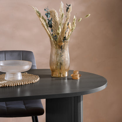 Crafted from premium MDF and available in two stylish finishes, oak or black, this oval table features beautiful fluted detailing that creates a modern, refined look. Shop online today at www.nobleandnook.co.uk