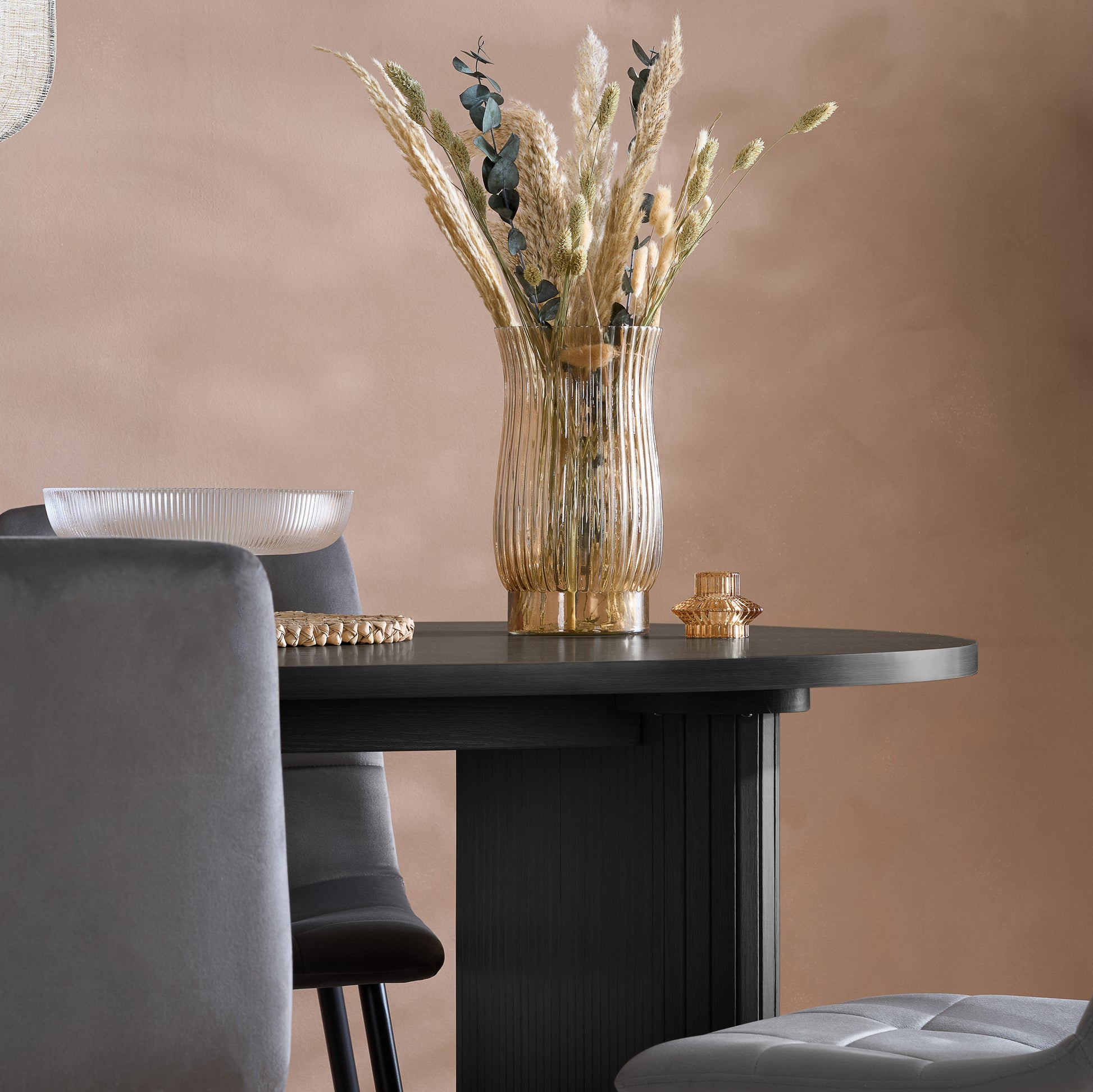 Crafted from premium MDF and available in two stylish finishes, oak or black, this oval table features beautiful fluted detailing that creates a modern, refined look. Shop online today at www.nobleandnook.co.uk