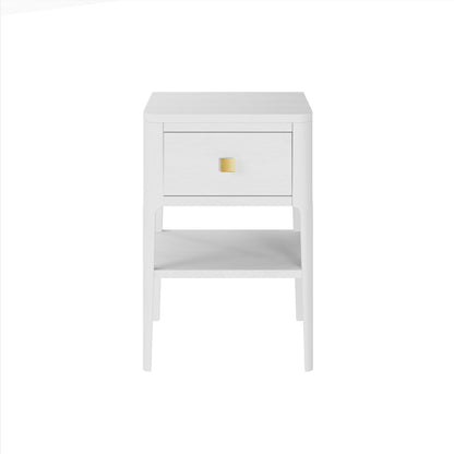 Indulge in understated luxury with our Abberley Bedside Table. Crafted from white stained solid oak and oak veneer, this curved front table boasts cut lines and visible grain for a sophisticated touch. Its metal runners and brass square handle add to the premium feel. Perfect for storing your essentials and adding a touch of elegance to any bedroom. By D.I. Design. Available at www.nobleandnook.co.uk